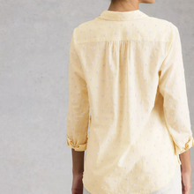 Load image into Gallery viewer, Light yellow blouse with subtle pattern on a gray background