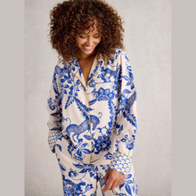 Load image into Gallery viewer, Woman wearing a blue and white patterned outfit on a plain background