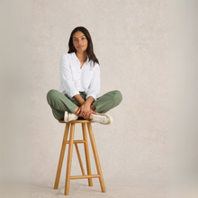 Load image into Gallery viewer, Women Sitting on stool in White Shirt on plain background