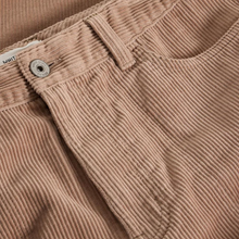 Load image into Gallery viewer, Close-up of brown corduroy pants with a button and waistband detail.