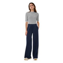 Load image into Gallery viewer, Front view of model wearing Esqualo Wide Stripe Modal Trousers in the colour Navy, with a white background.