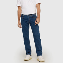 Load image into Gallery viewer, Person wearing blue jeans and a white shirt on a plain background
