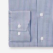 Load image into Gallery viewer, Close-up of a blue and white striped shirt with buttons on a white background

