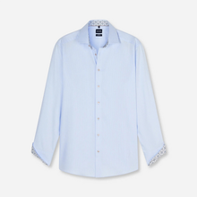 Load image into Gallery viewer, A light blue long-sleeve button-down shirt with patterned inner collar and cuffs, displayed flat against a light gray background.
