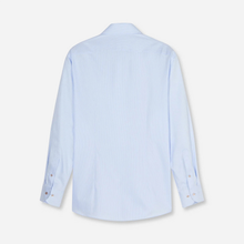 Load image into Gallery viewer, A light blue long-sleeve button-down shirt shown from the back, laid flat against a clean off-white background.
