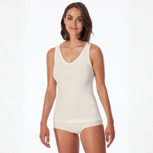 Load image into Gallery viewer, Woman wearing a white tank top and shorts on a white background
