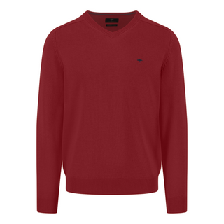 Red sweater with a small logo on a white background