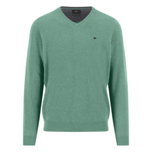 Load image into Gallery viewer, Green sweater with a small logo on a white background
