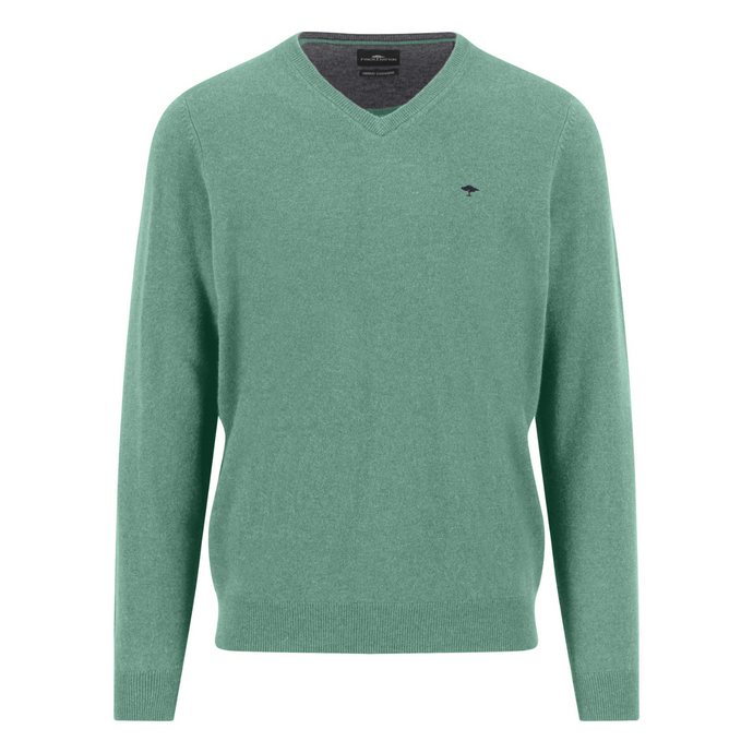 Green sweater with a small logo on a white background