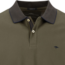 Load image into Gallery viewer, Green polo shirt with dark collar and brand label on a white background

