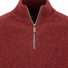 Load image into Gallery viewer, Close-up of a ribbed knit quarter-zip sweater in a heathered rust red color with orange and blue flecks, featuring a silver zipper and a small embroidered logo on the chest.
