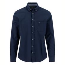 Load image into Gallery viewer, A dark navy blue long-sleeve button-down shirt with a single chest pocket and a small embroidered logo, displayed on a clean white background.
