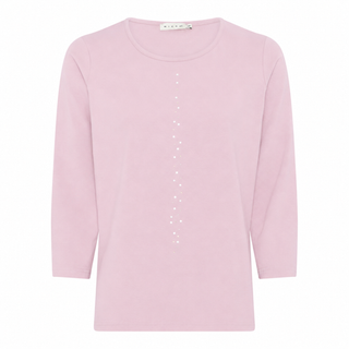 A light pink long-sleeve crewneck top with a vertical line of small white dots down the center front, displayed on a clean white background.