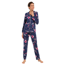 Load image into Gallery viewer, Pyjamas on a female model, button down front with navy palette and fuchsia flowers, model facing front on
