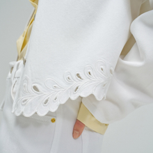 Load image into Gallery viewer, Close-up of a white shirt with lace detailing on the collar.
