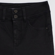 Load image into Gallery viewer, Close-up of a pair of black denim jeans showing the waistband with two dark metal buttons, belt loops, and a side pocket.
