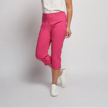 Load image into Gallery viewer, female model standing with arm down by side wearing pinns cropped trousers in fuschia colour
