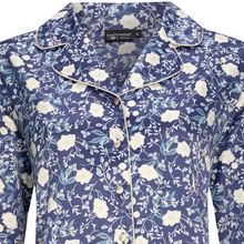 Load image into Gallery viewer, Close up of pyjama top with a navy base and a print of white petunia flowers
