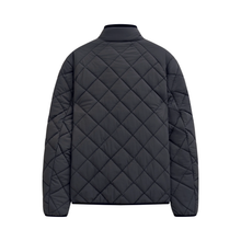 Load image into Gallery viewer, A navy diamond-quilted puffer jacket with a mock neck collar, shown from the back on a solid white background.
