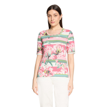 Load image into Gallery viewer, Woman wearing a floral and striped shirt on a white background
