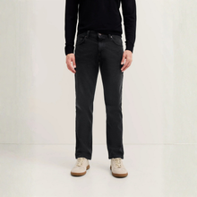 Load image into Gallery viewer, Person wearing black jeans and a black sweater on a white background
