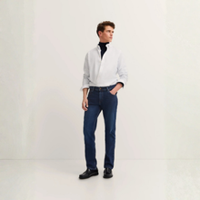 Load image into Gallery viewer, Man wearing a white shirt, dark jeans, and black shoes on a white background
