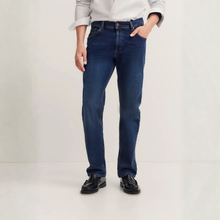 Load image into Gallery viewer, Person wearing blue jeans on a white background
