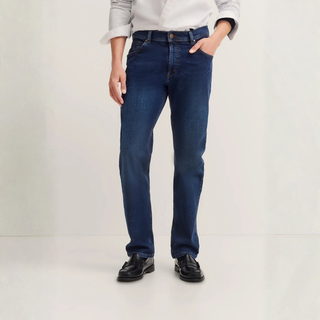 Person wearing blue jeans on a white background