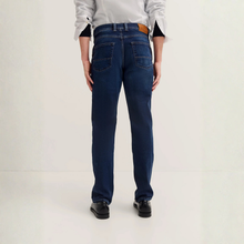 Load image into Gallery viewer, Person wearing blue jeans on a plain background
