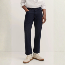 Load image into Gallery viewer, Person wearing navy pants and a white shirt on a plain background
