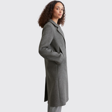 Load image into Gallery viewer, female model looking at camera wearing marc opolo wool coat in grey colour
