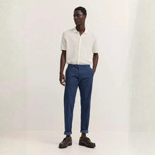 Load image into Gallery viewer, Man wearing a white shirt and blue pants on a white background
