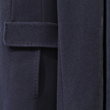 Load image into Gallery viewer, Close-up of a dark navy wool coat showing the lapel tab and fabric texture.
