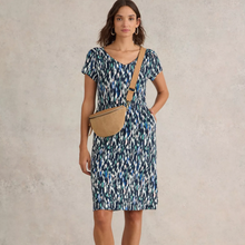 Load image into Gallery viewer, female model looking at camera wearing whitestuff tallie jersey dress in navy colour
