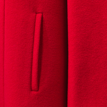 Load image into Gallery viewer, A close-up of a bright red textured fabric with a vertical channel or slit detail.

