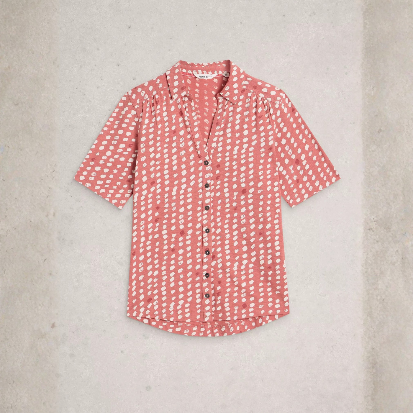 Load image into Gallery viewer, Red patterned shirt on a light gray background