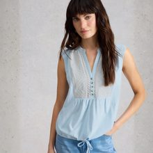 Load image into Gallery viewer, Woman wearing a light blue sleeveless top with intricate details against a neutral background
