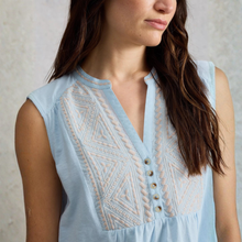 Load image into Gallery viewer, Light blue sleeveless top with intricate white embroidery on a neutral background
