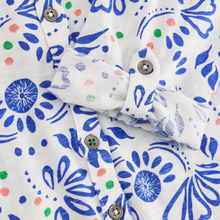 Load image into Gallery viewer, Close-up of a fabric with blue floral pattern and colorful accents
