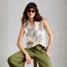 Load image into Gallery viewer, Woman wearing a floral sleeveless top and green pants against a gray background
