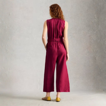 Load image into Gallery viewer, Person wearing a burgundy jumpsuit standing against a plain background

