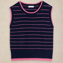 Load image into Gallery viewer, A sleeveless ribbed knit sweater vest in navy blue with thin horizontal pink stripes and pink trim on the neckline, armholes, and hem, laid flat on a light beige background. The brand label reads 'SWEATER VEST'.
