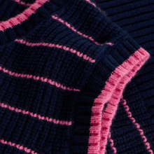 Load image into Gallery viewer, Close-up of a ribbed knit fabric in dark navy blue with contrasting pink stripes and trim.
