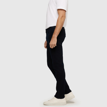 Load image into Gallery viewer, Person wearing black pants and a white shirt on a plain background
