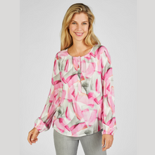 Load image into Gallery viewer, female model smiling looking at camera wearing rabe abstract top in pink &amp; grey colour
