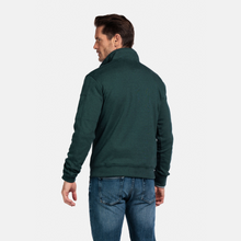Load image into Gallery viewer, Man wearing a green jacket and blue jeans on a white background
