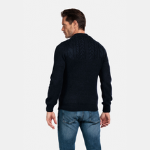 Load image into Gallery viewer, Man wearing a black cable knit sweater and blue jeans on a white background
