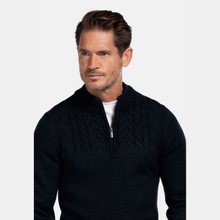 Load image into Gallery viewer, Man wearing a black quarter-zip sweater on a white background

