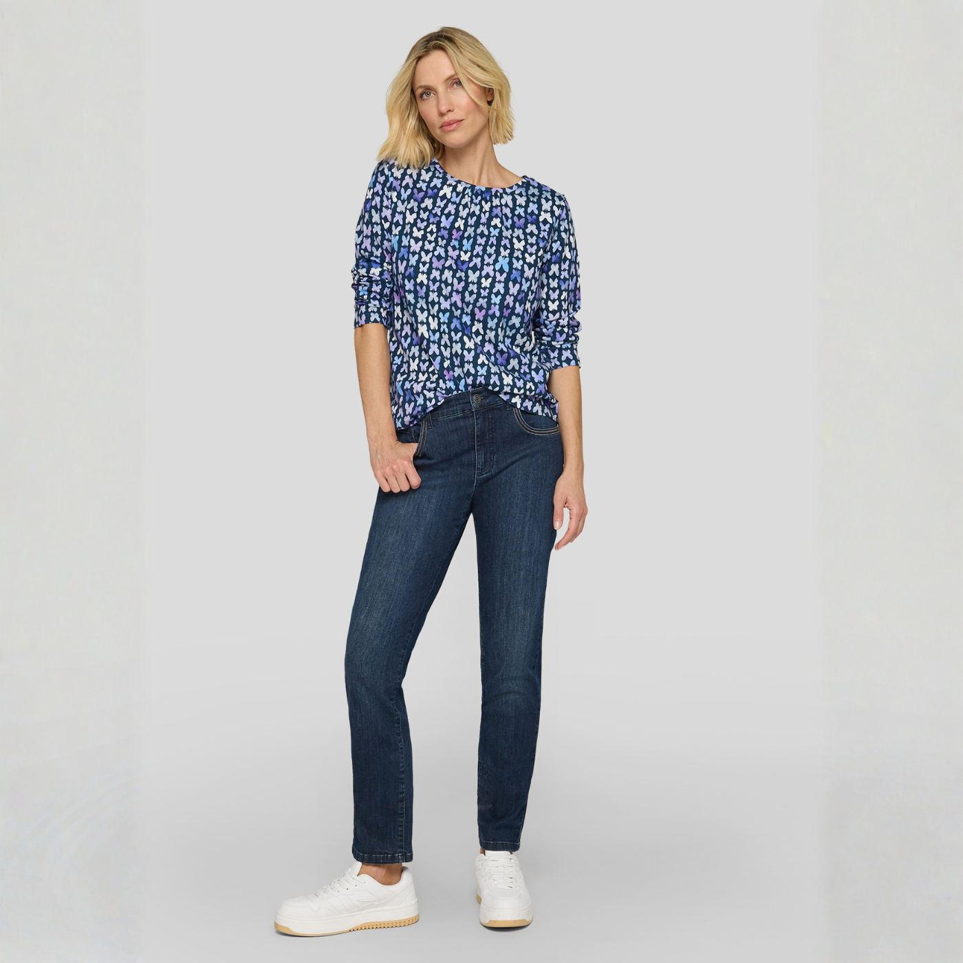 Load image into Gallery viewer, Model wearing a Rabe Top with a delicate butterfly print