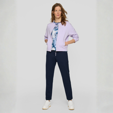 Load image into Gallery viewer, Model wearing a Rabe Zip cardigan in lilac
